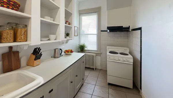 a utility room with sink dryer and washer