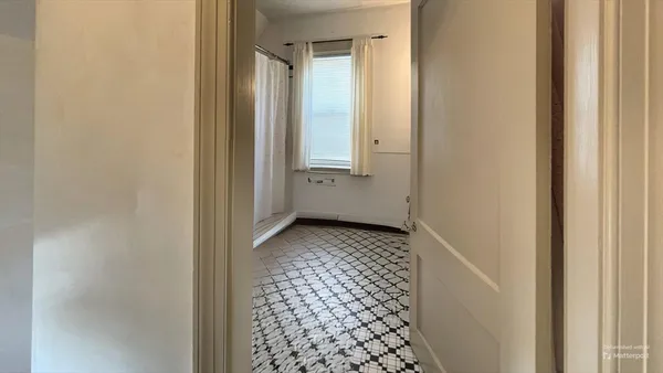 a bathroom with a glass door