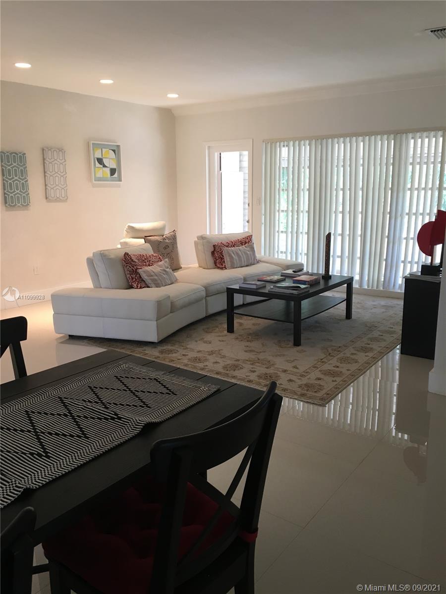 60 Park Drive, Unit D Bal Harbour, FL 33154 - Photo 4 of 13 a living room with furniture and a couch