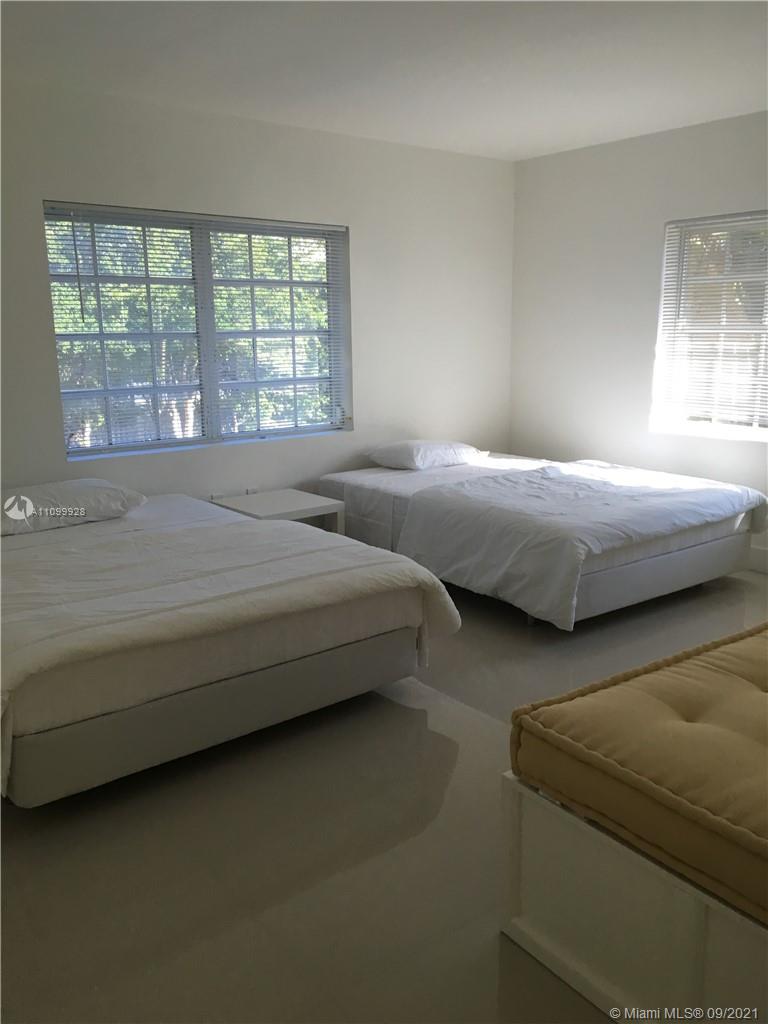 60 Park Drive, Unit D Bal Harbour, FL 33154 - Photo 9 of 13 a bedroom with bed couch and window