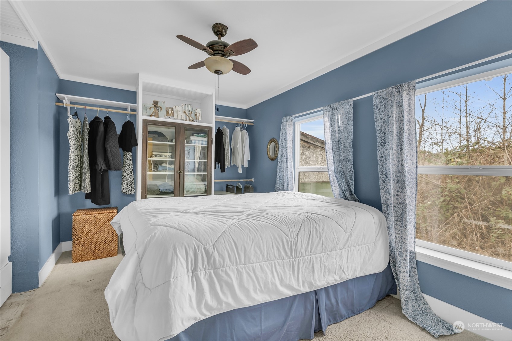 25115 72nd Avenue East Graham, WA 98338 - Photo 12 of 24 a bedroom with a large bed and a large window