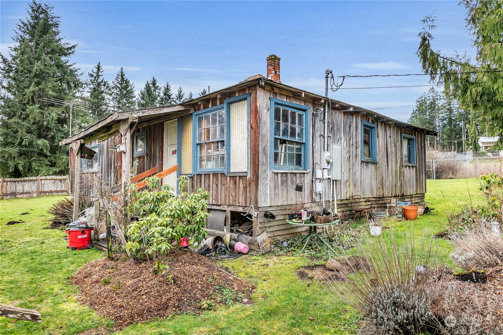 25115 72nd Avenue East Graham, WA 98338 - Photo 17 of 24 a view of a house with a yard and garden