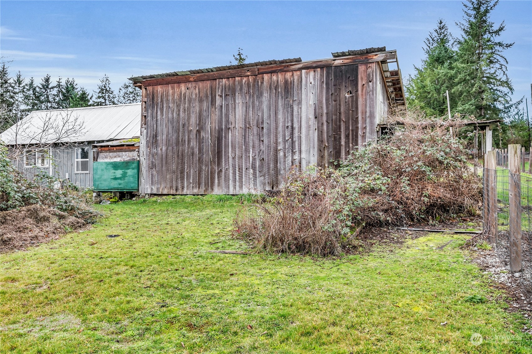 25115 72nd Avenue East Graham, WA 98338 - Photo 20 of 24 a view of backyard with potted plants and wooden fence