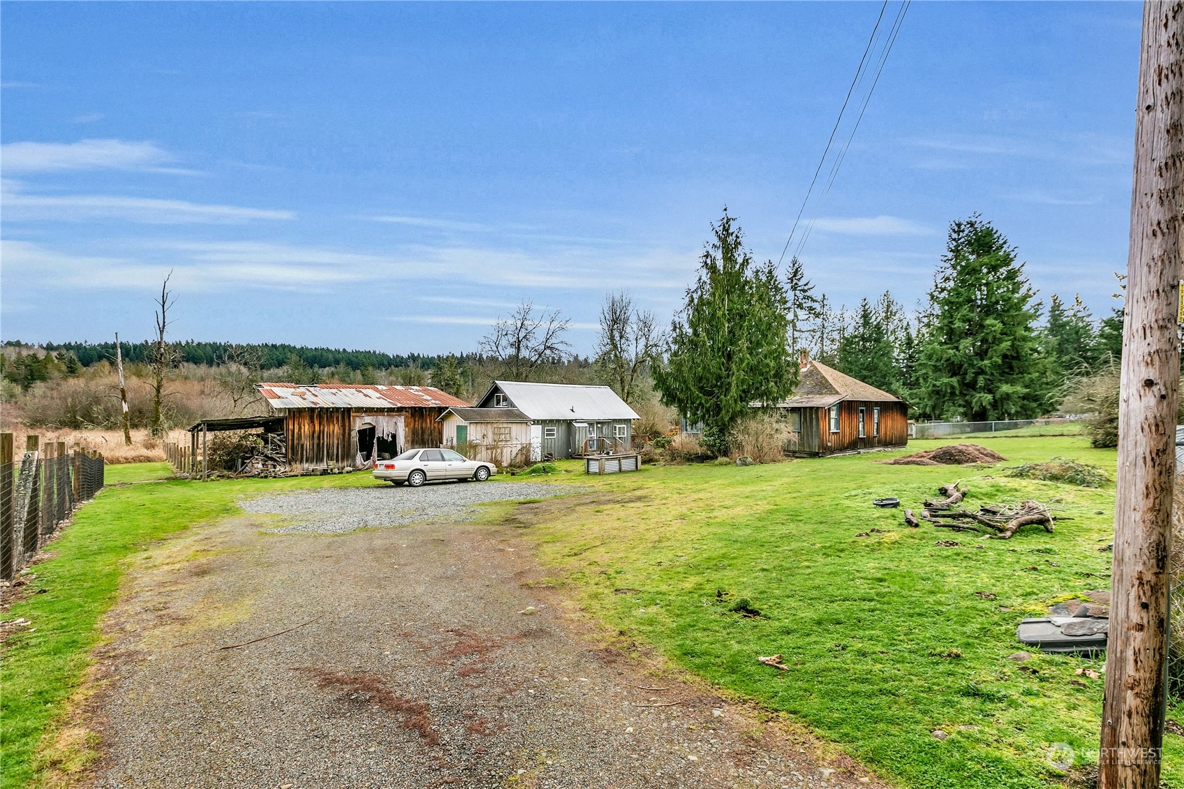25115 72nd Avenue East Graham, WA 98338 - Photo 3 of 24 a front view of a house with a yard and trees