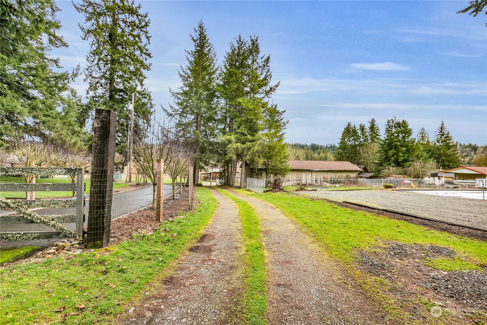 25115 72nd Avenue East Graham, WA 98338 - Photo 4 of 24 a view of a swimming pool with an outdoor space and seating area