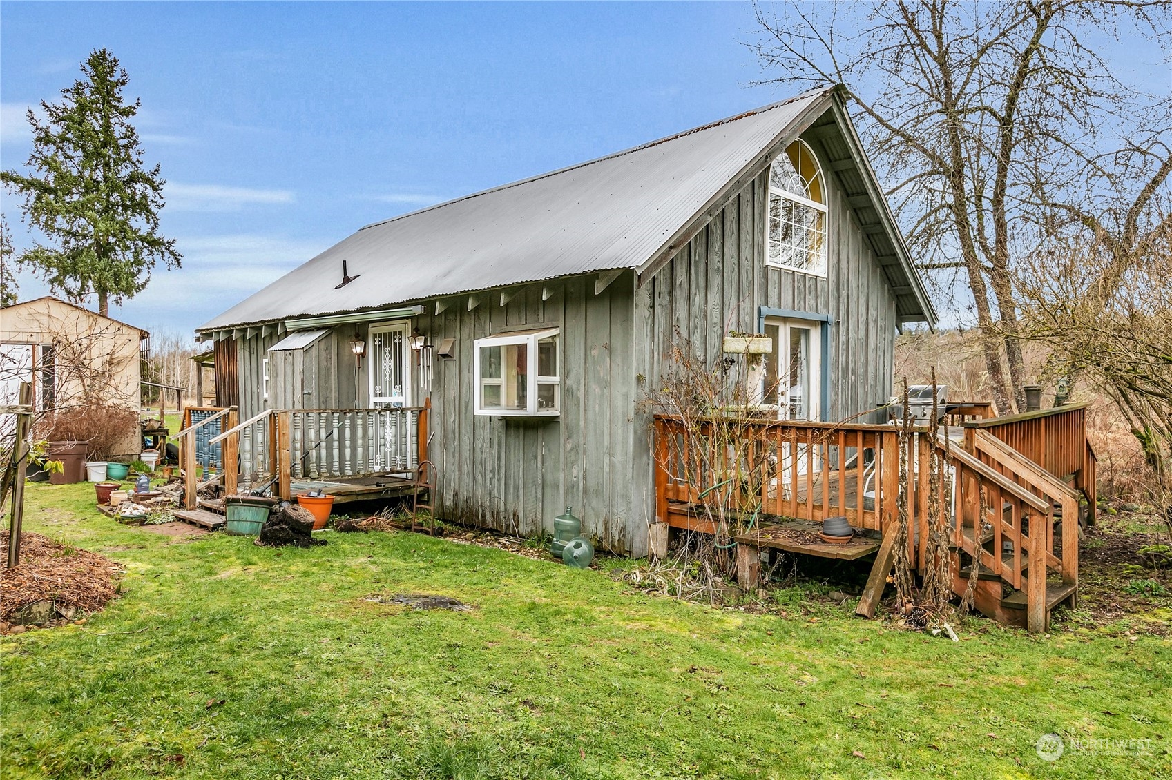 25115 72nd Avenue East Graham, WA 98338 - Photo 5 of 24 a backyard of a house with yard and trampoline