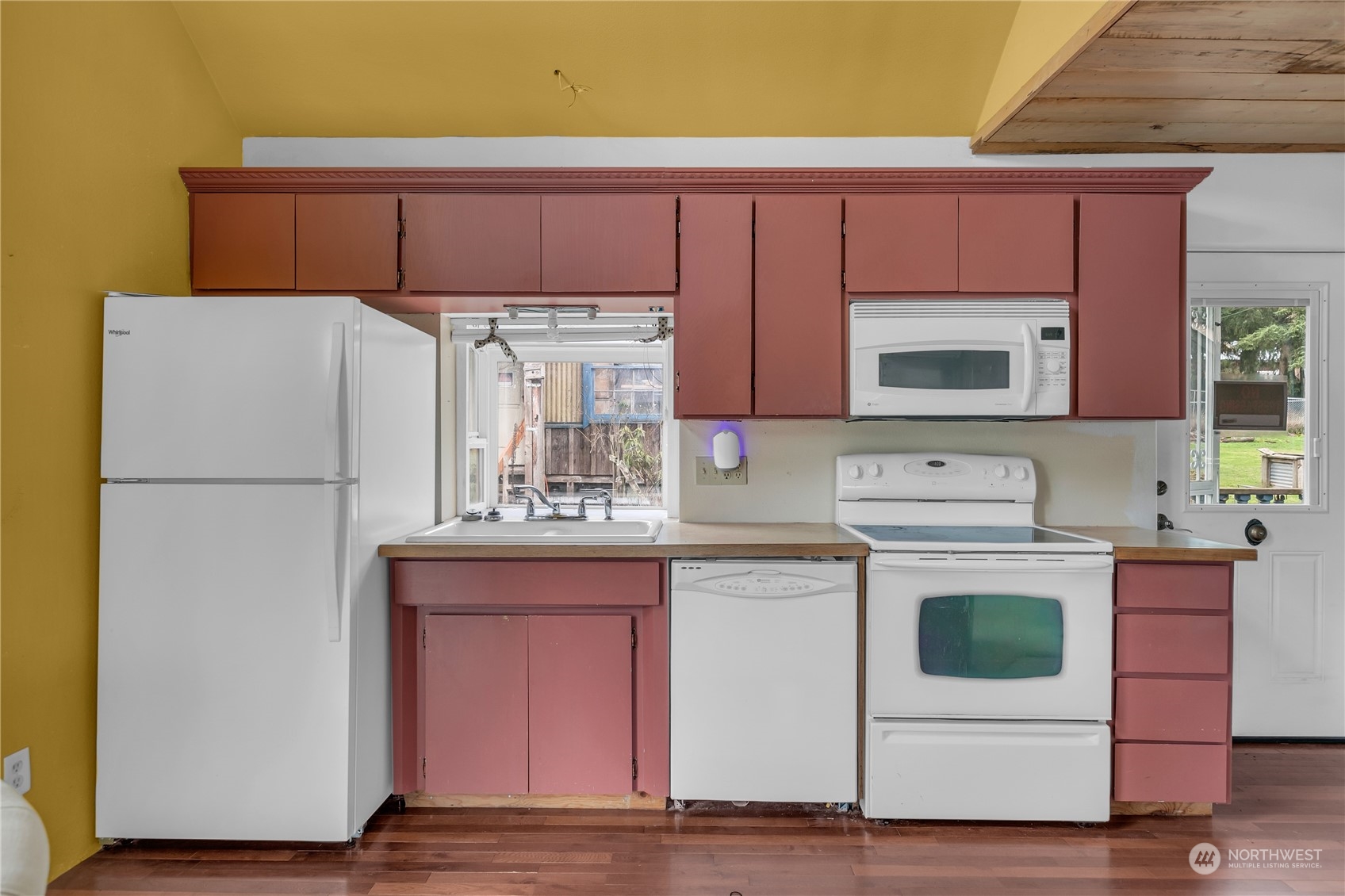 25115 72nd Avenue East Graham, WA 98338 - Photo 9 of 24 a kitchen with stainless steel appliances a refrigerator stove and microwave
