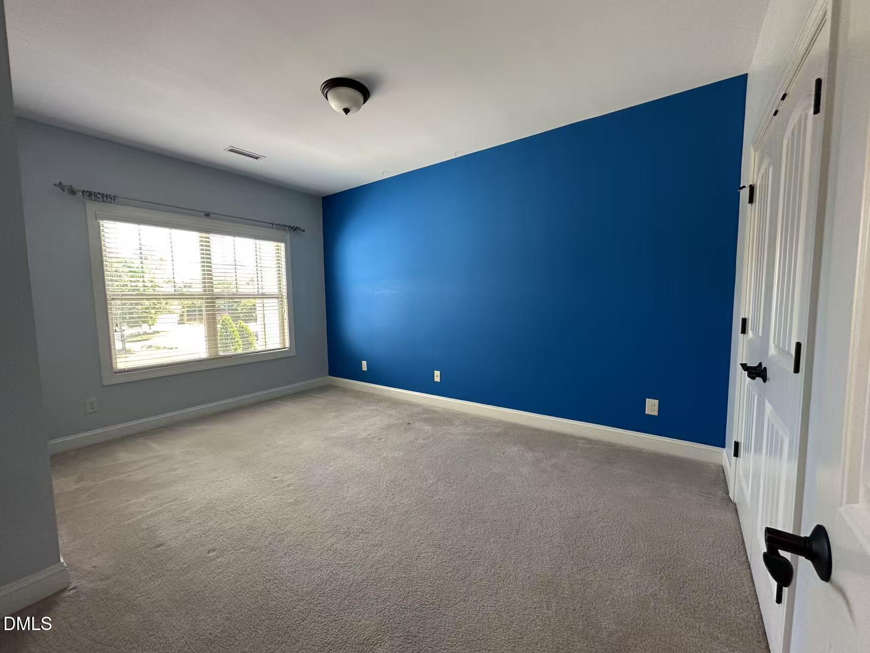 1056 Indigo Ridge Place Cary, NC 27519 - Photo 21 of 33 an empty room with windows