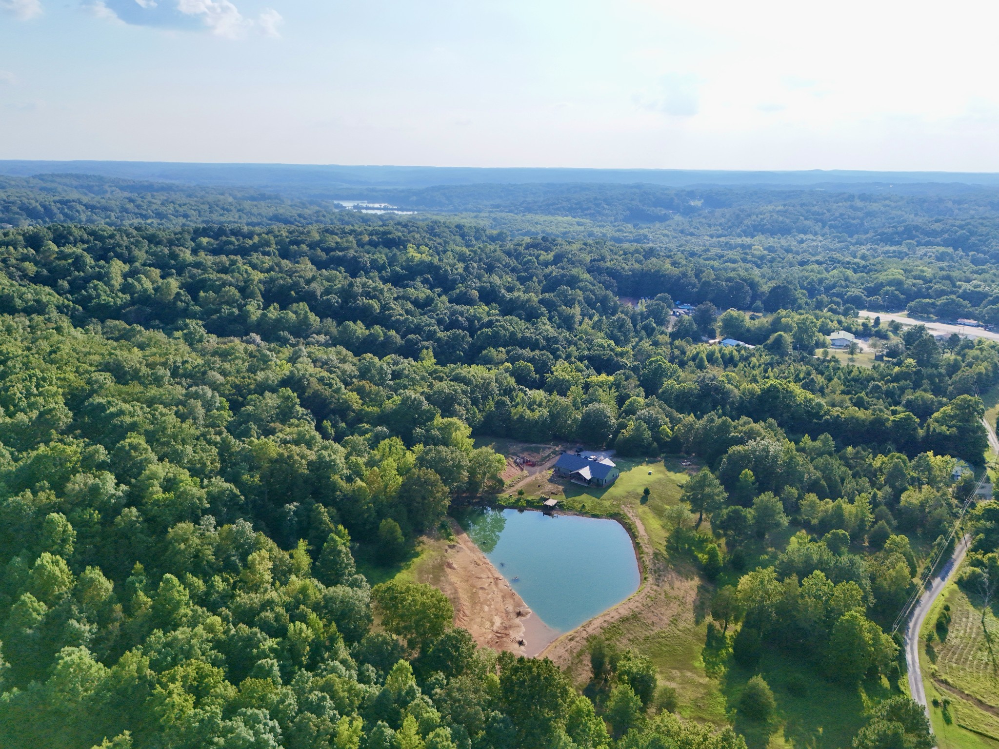 330 Durwachter Road Dover, TN 37058 - Photo 20 of 86 an aerial view of a house with a yard and lake view