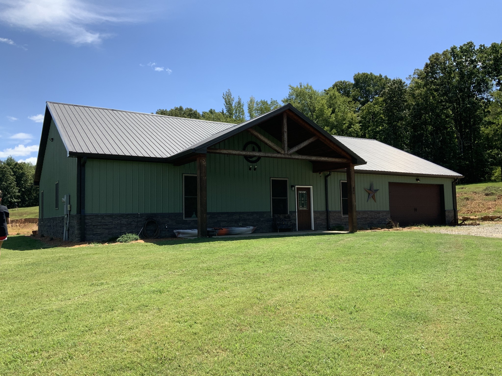 330 Durwachter Road Dover, TN 37058 - Photo 21 of 86 a front view of a house with a yard and garage