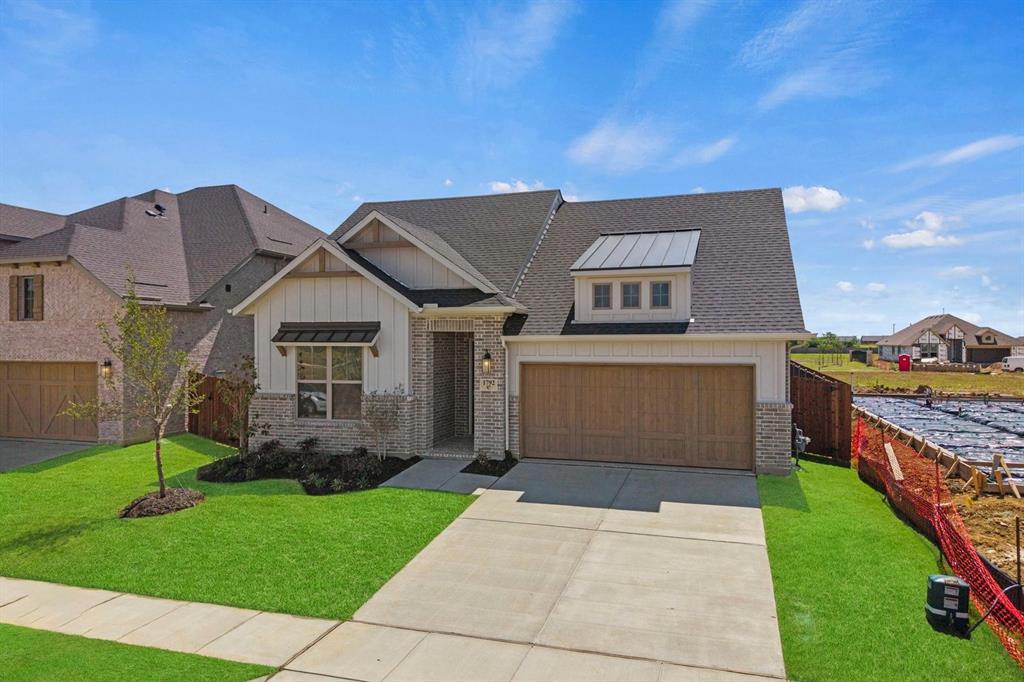 1792 Monarch Way Oak Point, TX 75068 - Photo 4 of 26 a front view of house with yard and green space