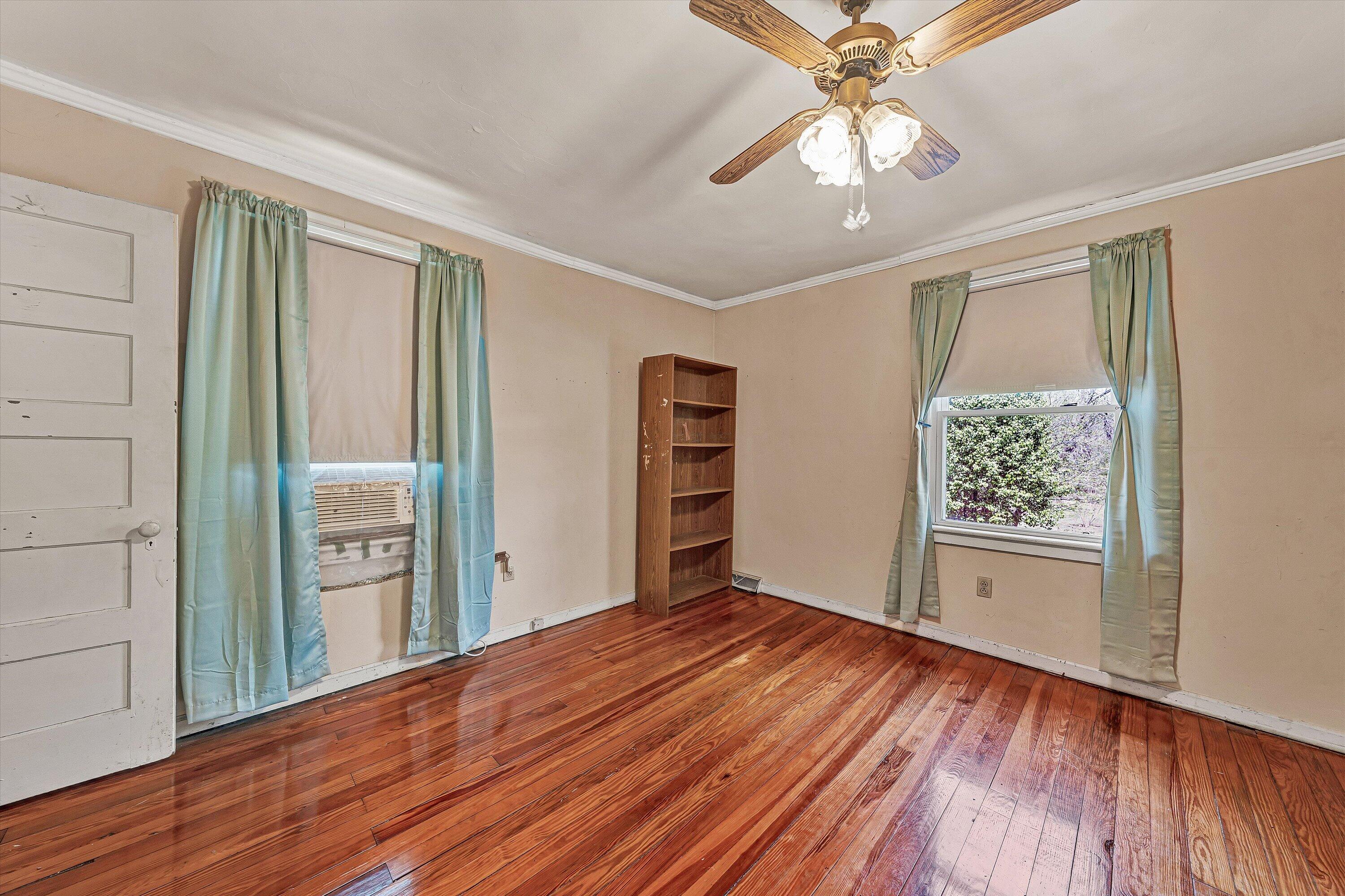 4787 Glade Creek Road Roanoke, VA 24012 - Photo 15 of 37 wooden floor in an empty room with a window