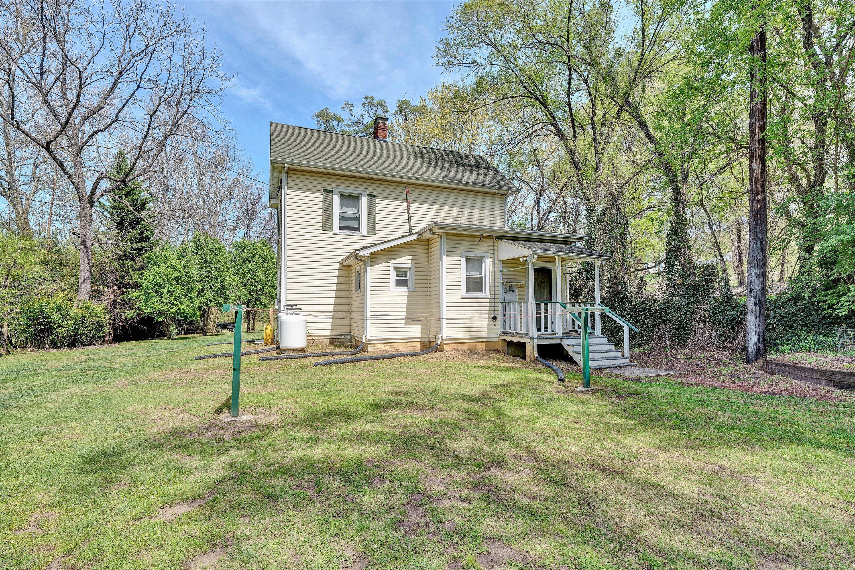 4787 Glade Creek Road Roanoke, VA 24012 - Photo 18 of 37 a view of a house with a yard and sitting area