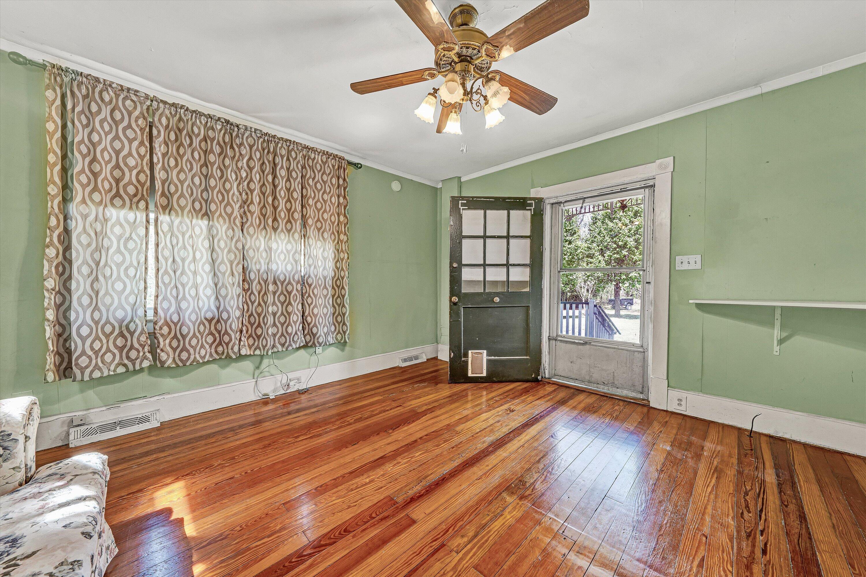 4787 Glade Creek Road Roanoke, VA 24012 - Photo 5 of 37 wooden floor in an empty room with a window