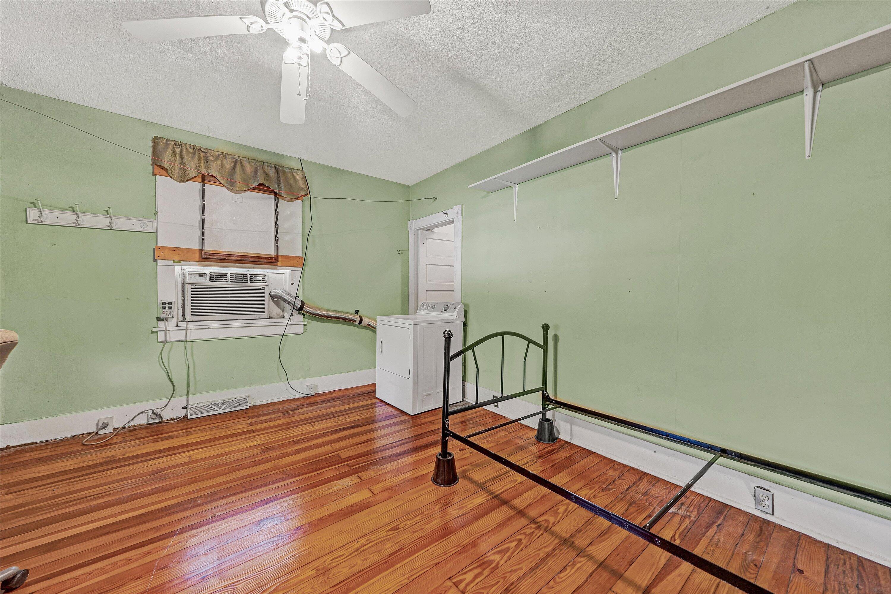 4787 Glade Creek Road Roanoke, VA 24012 - Photo 7 of 37 a view of a room with wooden floor and fan