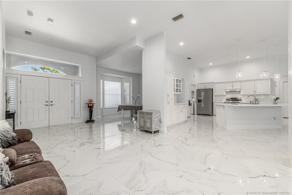 5374 Southeast Horseshoe Point Road Stuart, FL 34997 - Photo 13 of 38 a view of kitchen with refrigerator and window