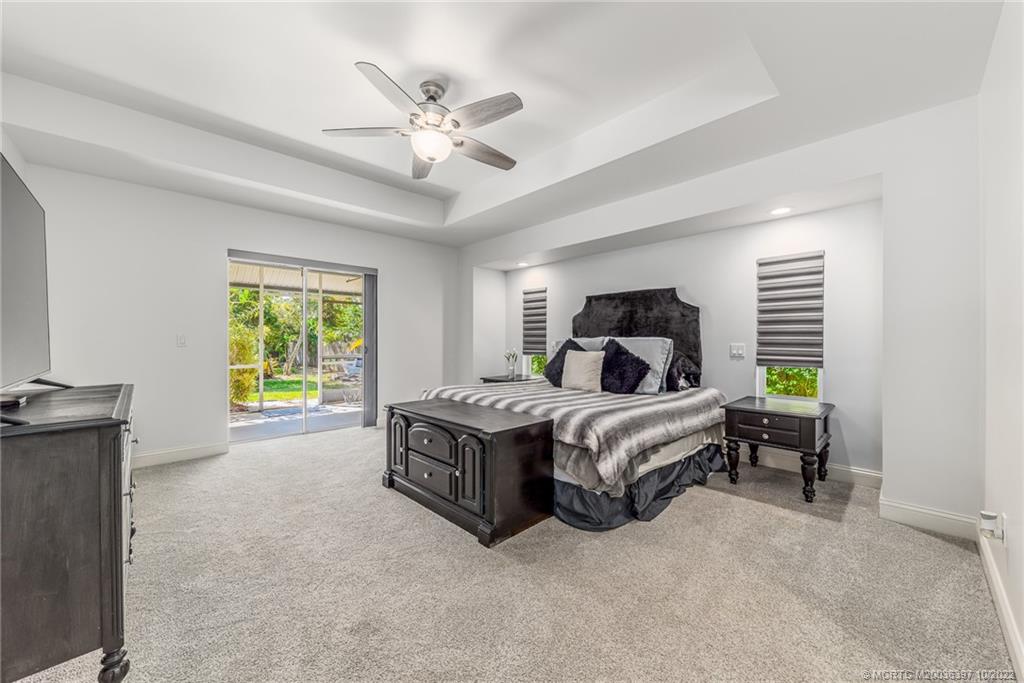 5374 Southeast Horseshoe Point Road Stuart, FL 34997 - Photo 20 of 38 a bedroom with a bed and a window