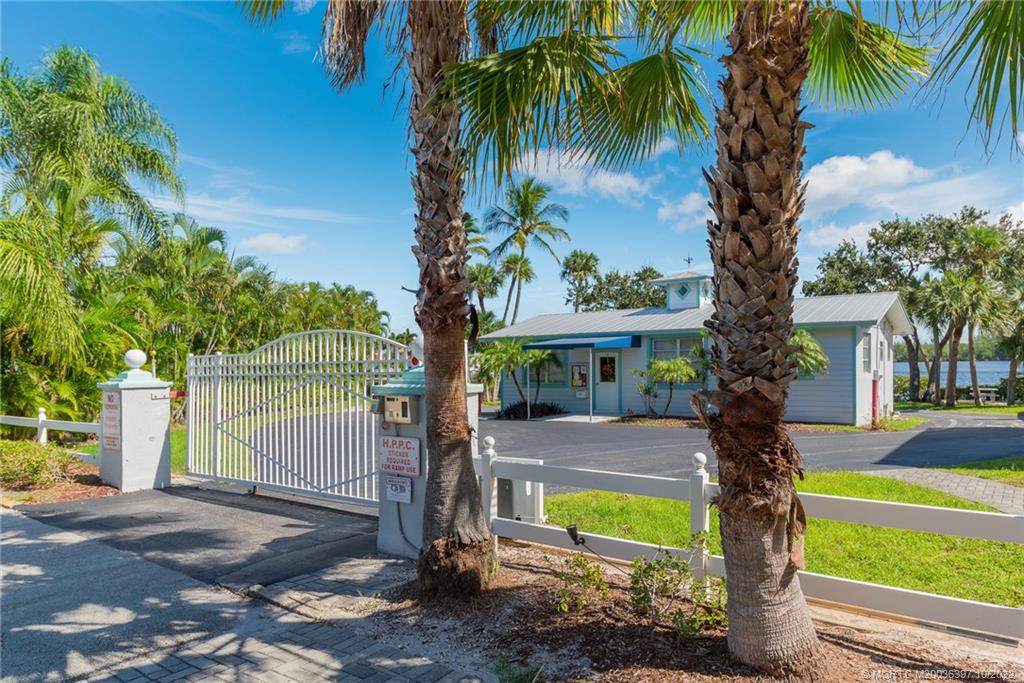 5374 Southeast Horseshoe Point Road Stuart, FL 34997 - Photo 34 of 38 a front view of a house with garden