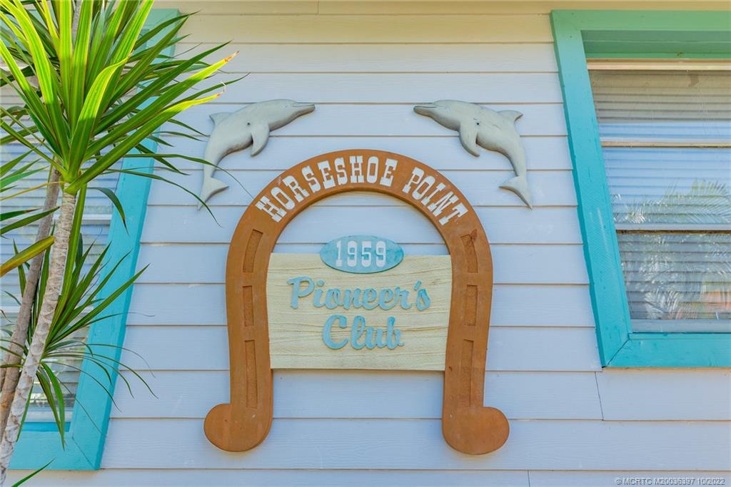 5374 Southeast Horseshoe Point Road Stuart, FL 34997 - Photo 36 of 38 a close up of a sign on a wall