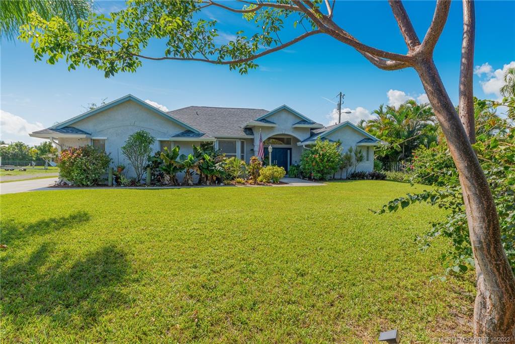 5374 Southeast Horseshoe Point Road Stuart, FL 34997 - Photo 5 of 38 a front view of house with yard and green space