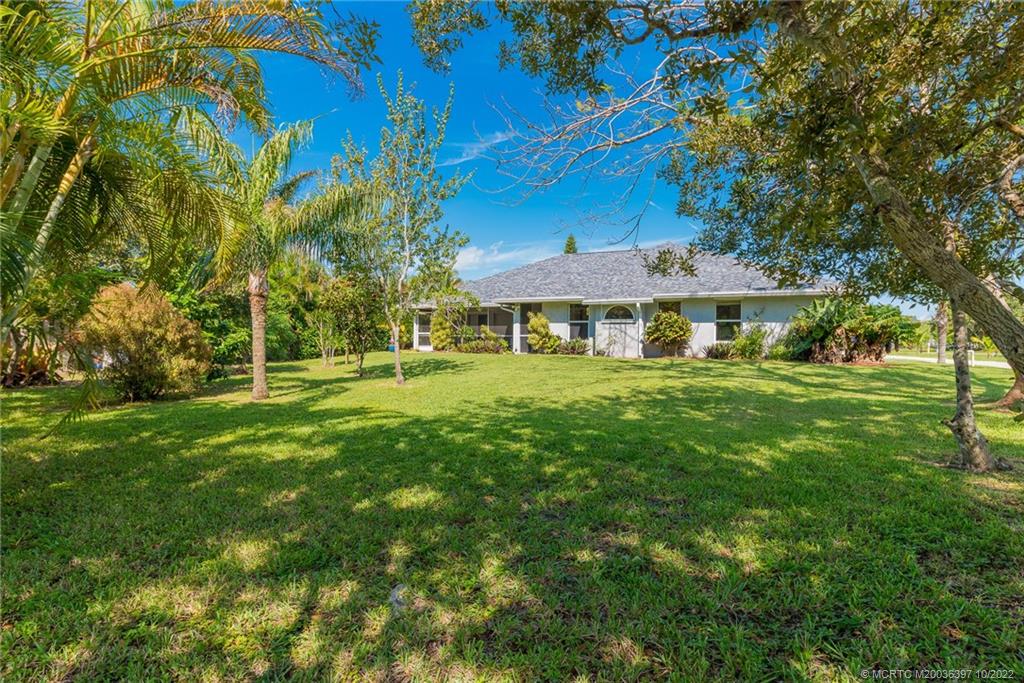 5374 Southeast Horseshoe Point Road Stuart, FL 34997 - Photo 6 of 38 a view of a house with a big yard