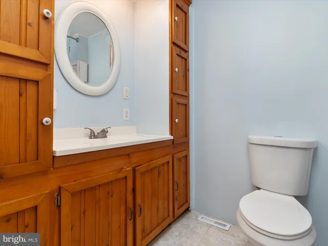 a bathroom with a shower curtain and a toilet
