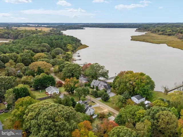 a view of a livingroom with wooden floor and a window