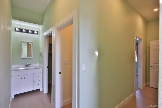 a bathroom with a sink a mirror and a shower