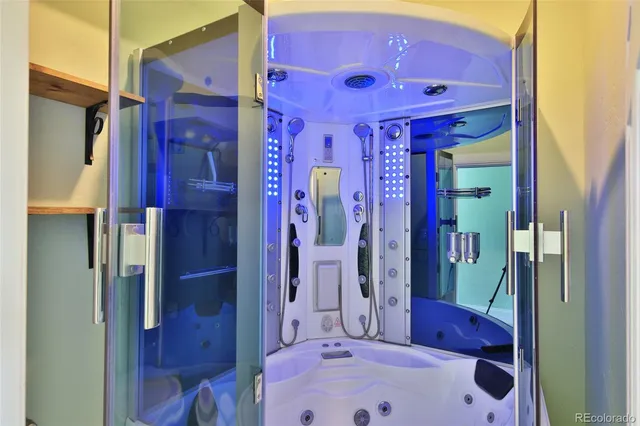 a bathroom with a sink a bath tub and shower