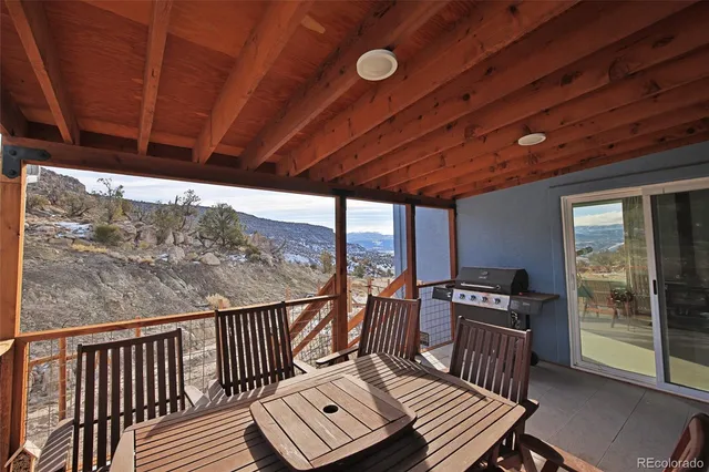 a view of a balcony with chairs