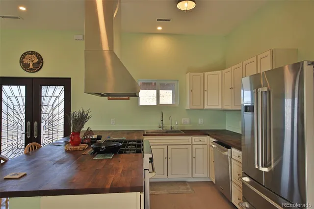 a kitchen with a sink appliances and cabinets