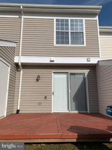 a view of front door and small yard