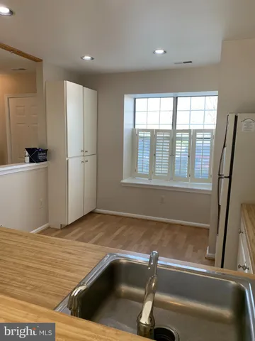 a view of a kitchen with a sink and dishwasher