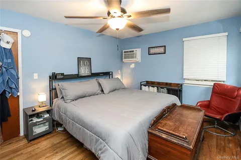 a bedroom with a bed and a couch