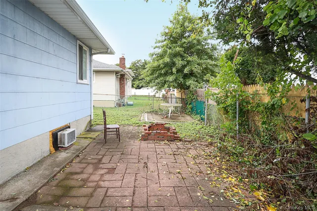 a backyard of a house with outdoor seating