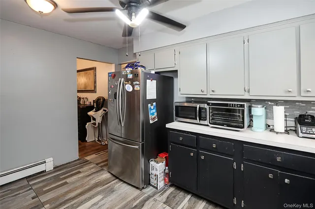 a kitchen with stainless steel appliances granite countertop a refrigerator a sink and dishwasher
