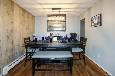 a view of a workspace with furniture and window