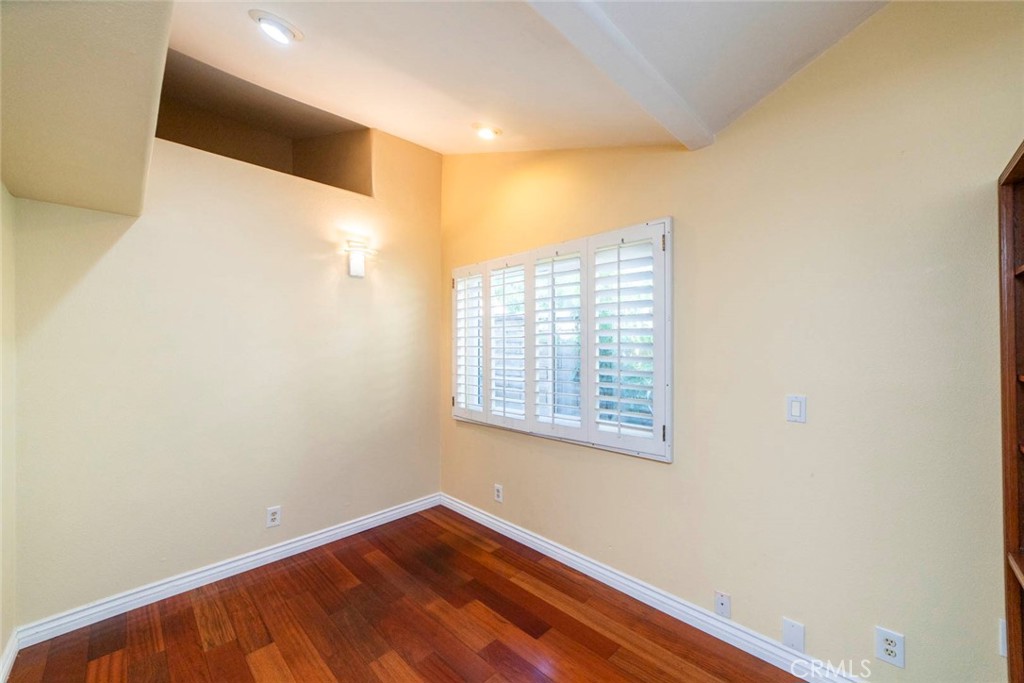 1 Camden Irvine, CA 92620 - Photo 13 of 43 a view of an empty room with wooden floor and a window