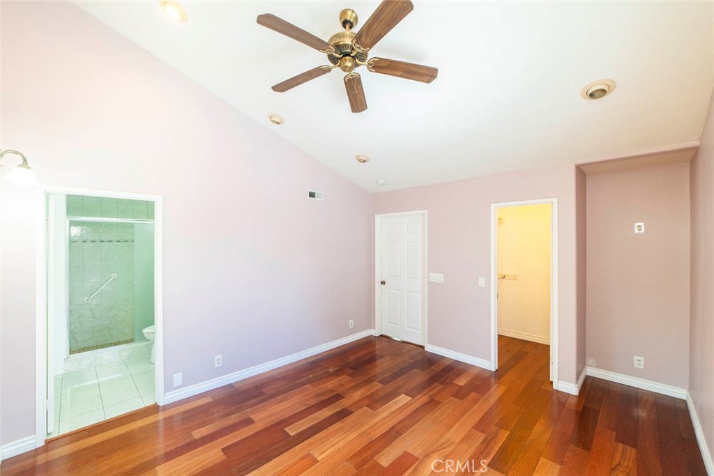 1 Camden Irvine, CA 92620 - Photo 16 of 43 a bedroom with a bed and a ceiling fan