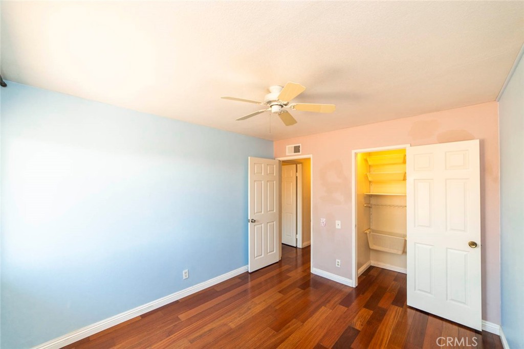 1 Camden Irvine, CA 92620 - Photo 19 of 43 an empty room with wooden floor and a ceiling fan