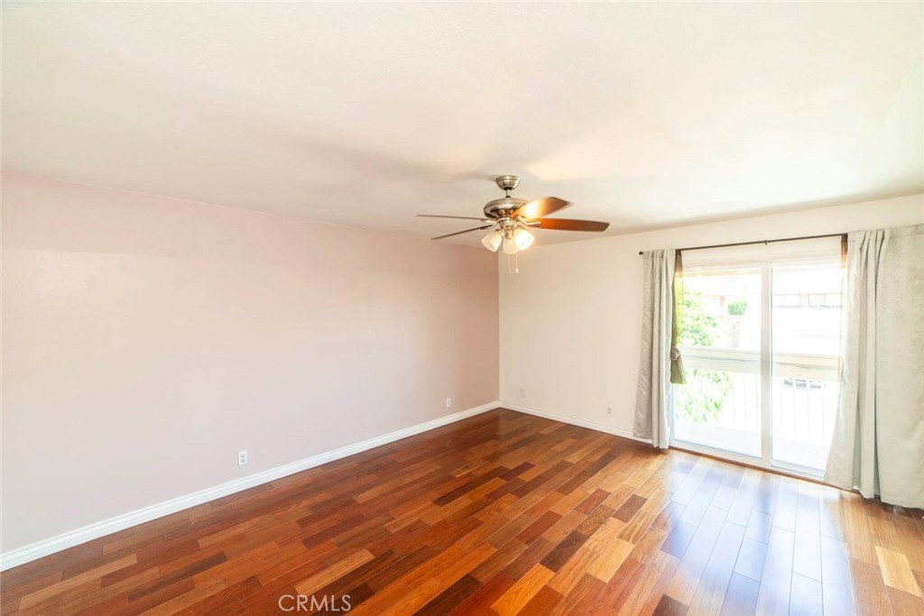 1 Camden Irvine, CA 92620 - Photo 23 of 43 an empty room with wooden floor fan and windows