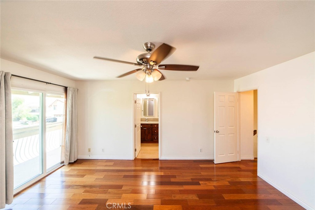 1 Camden Irvine, CA 92620 - Photo 24 of 43 a view of a livingroom with wooden floor and a ceiling fan