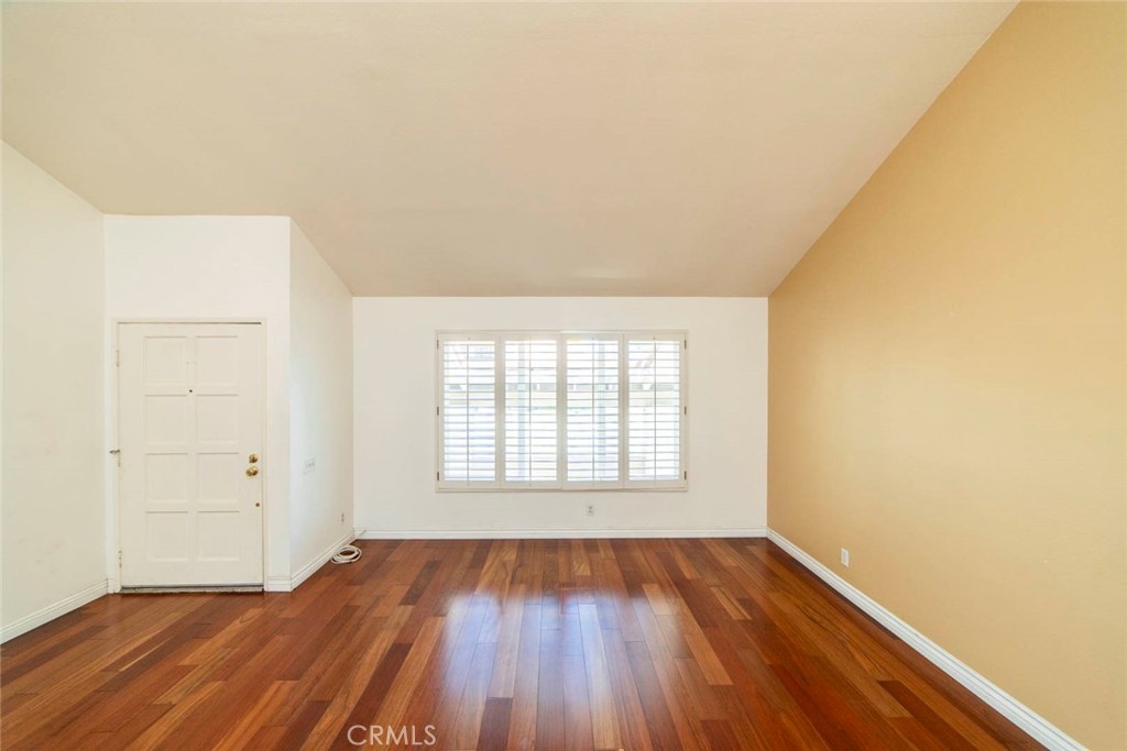 1 Camden Irvine, CA 92620 - Photo 4 of 43 an empty room with wooden floor and windows