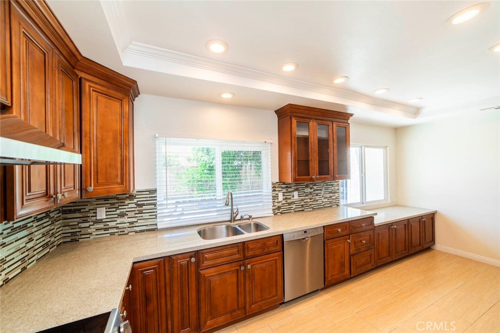 1 Camden Irvine, CA 92620 - Photo 9 of 43 a bathroom with a granite countertop sink and a large mirror