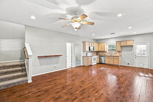 13396 Teel Road Montgomery, TX 77356 - Photo 9 of 50 a view of kitchen with wooden floor electronic appliances and window