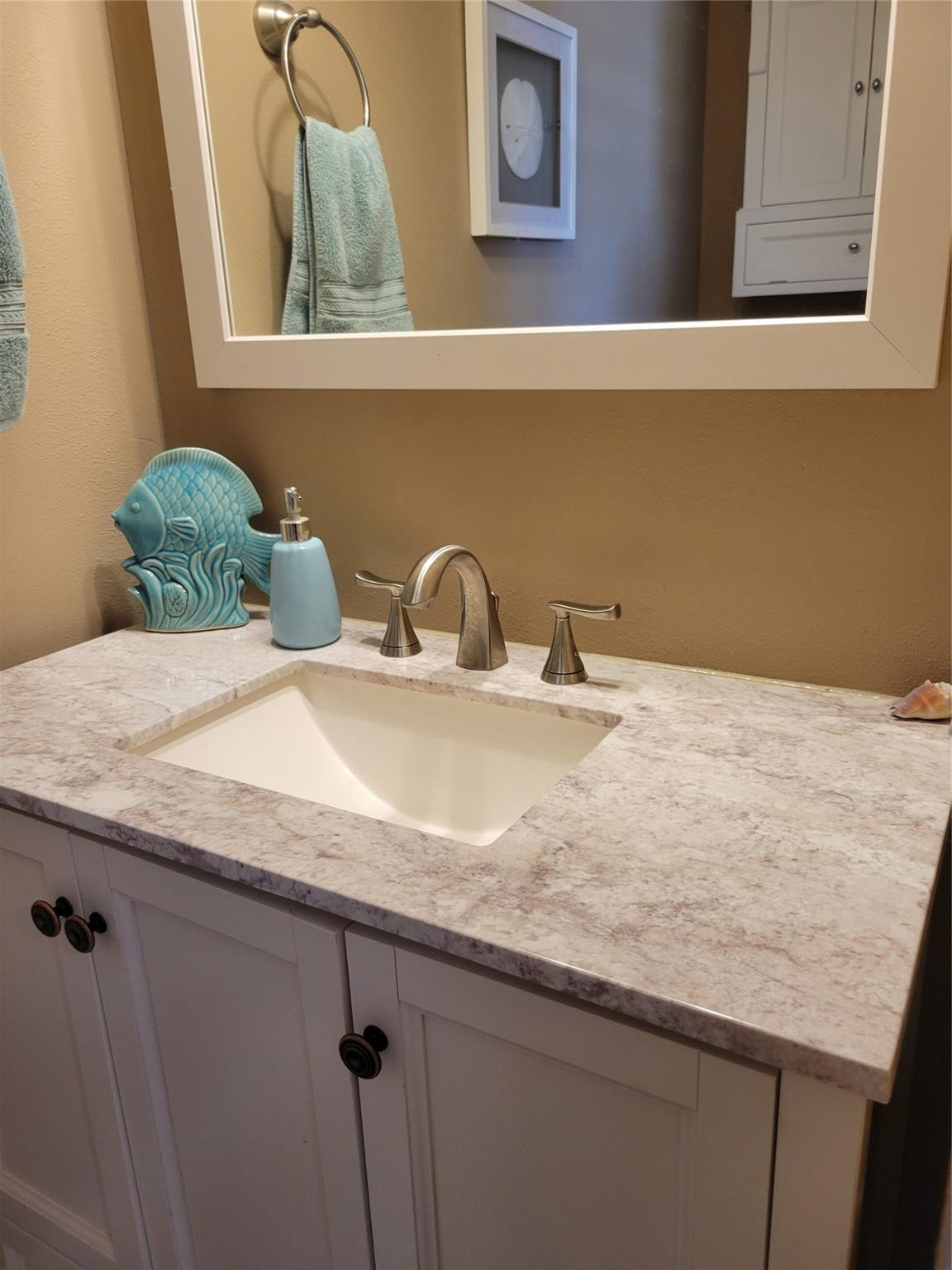 628 Southwest 35th Street Okeechobee, FL 34974 - Photo 15 of 27 a bathroom with a granite countertop sink and a mirror