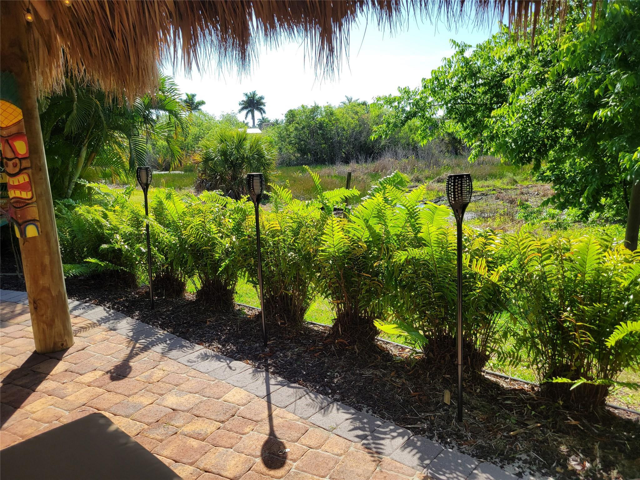 628 Southwest 35th Street Okeechobee, FL 34974 - Photo 26 of 27 a backyard of a house with lots of green space