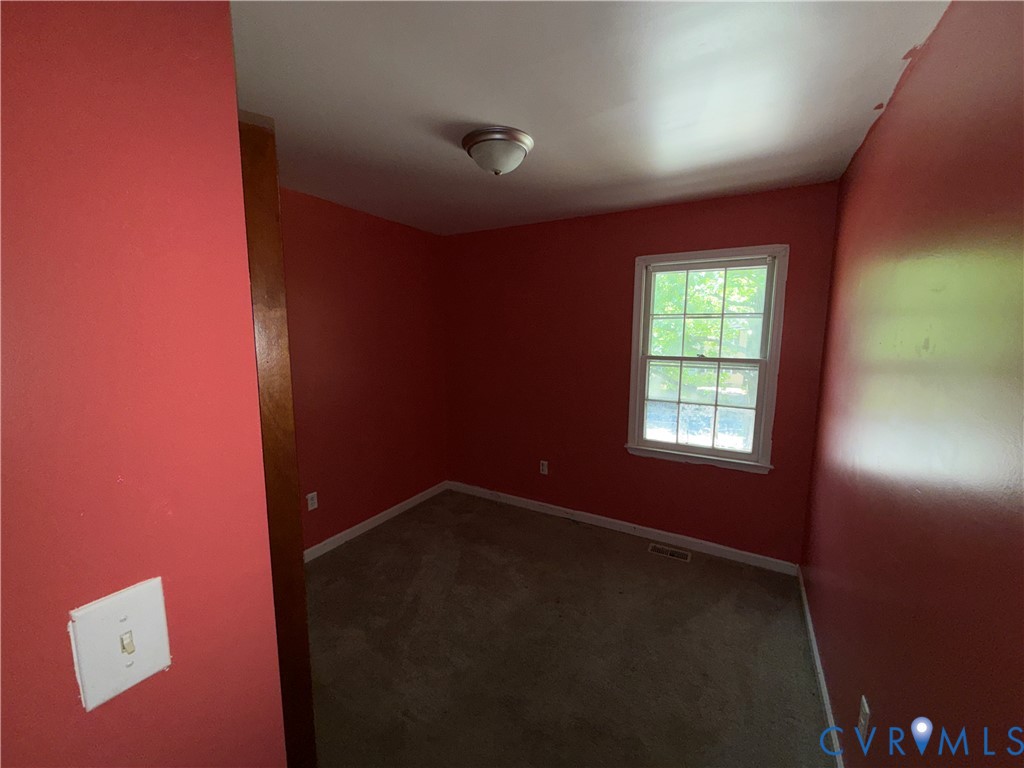 1607 Old Iron Road Hopewell, VA 23860 - Photo 10 of 12 an empty room with windows
