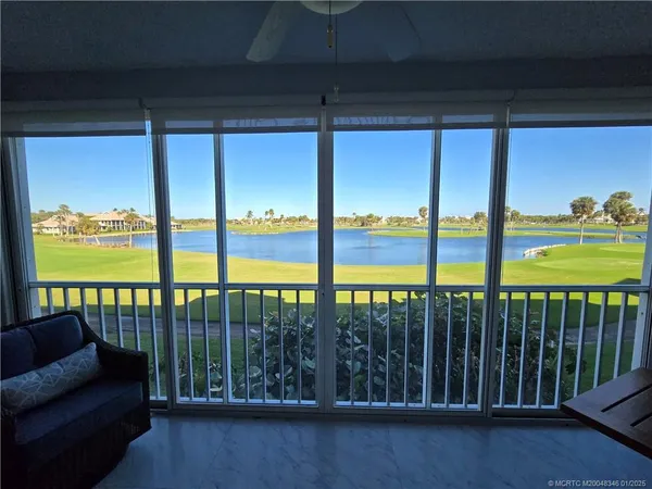 a view of balcony with furniture