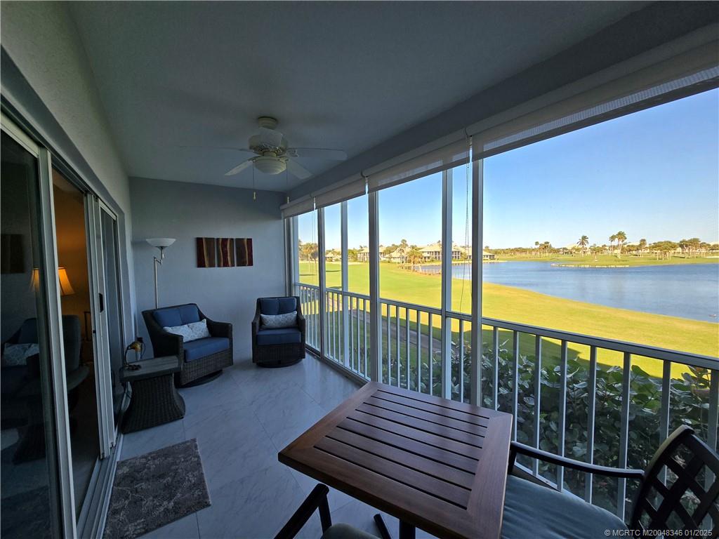 185 Northeast Edgewater Drive, Unit 5105 Stuart, FL 34996 - Photo 15 of 28 a balcony with wooden floor outdoor seating and city view